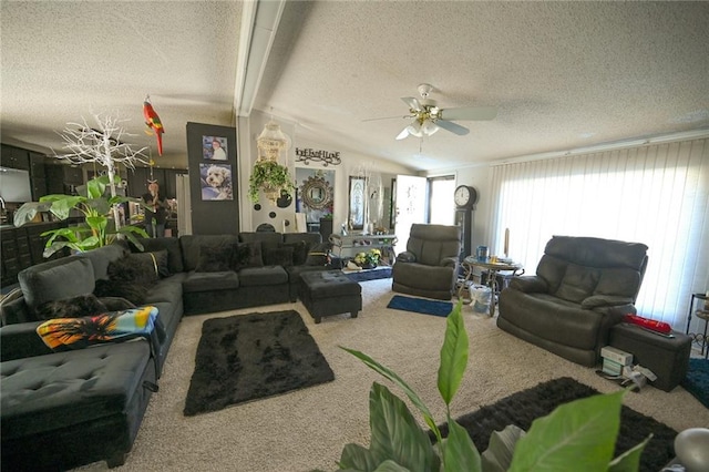 living room with carpet, vaulted ceiling with beams, ceiling fan, and a textured ceiling