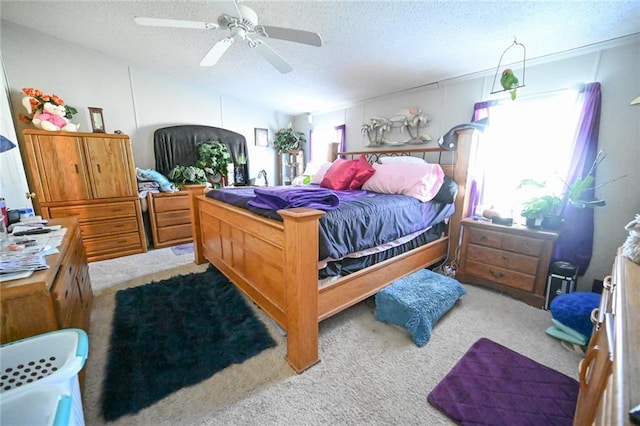 bedroom with multiple windows, ceiling fan, and light carpet