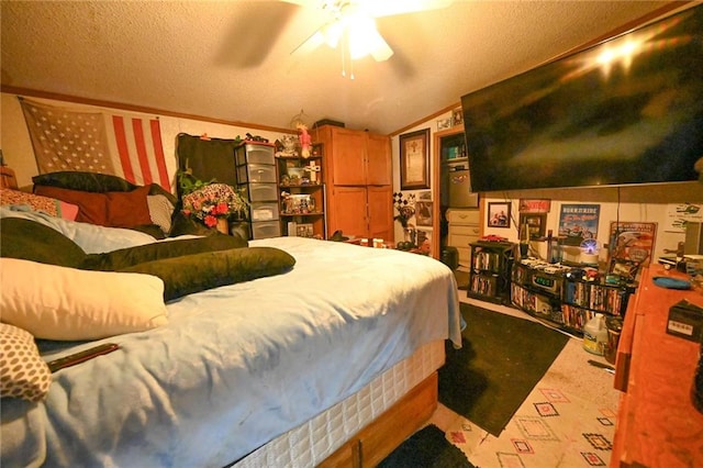 bedroom featuring vaulted ceiling, ceiling fan, light carpet, and a textured ceiling