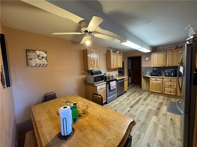 kitchen featuring decorative backsplash, light hardwood / wood-style flooring, ceiling fan, and appliances with stainless steel finishes