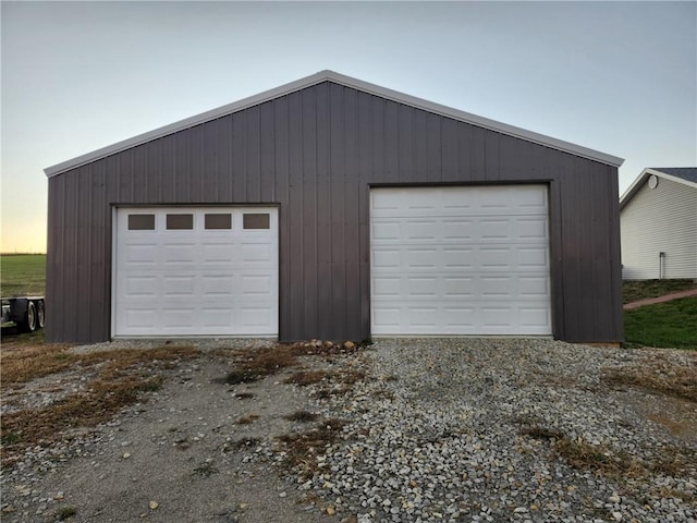 view of garage at dusk