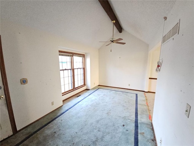 spare room with carpet, a textured ceiling, lofted ceiling with beams, and ceiling fan