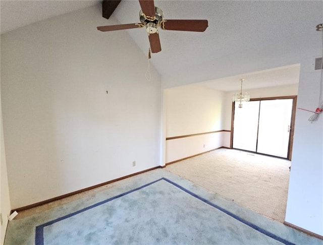 spare room with carpet flooring, vaulted ceiling with beams, ceiling fan, and a textured ceiling