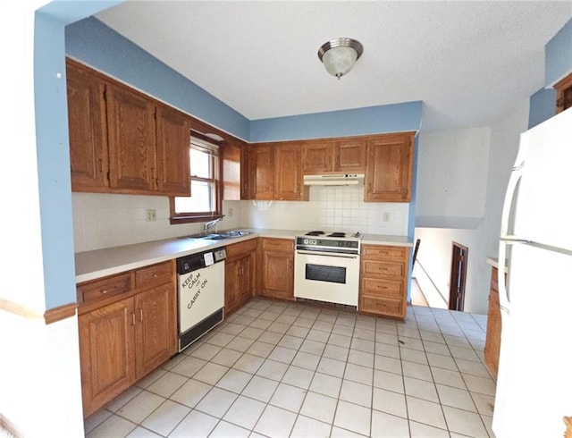 kitchen featuring backsplash, white appliances, sink, and light tile patterned floors