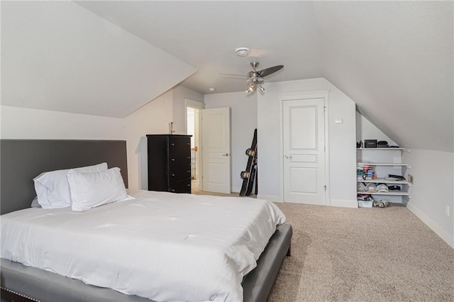 bedroom featuring carpet floors, ceiling fan, and lofted ceiling