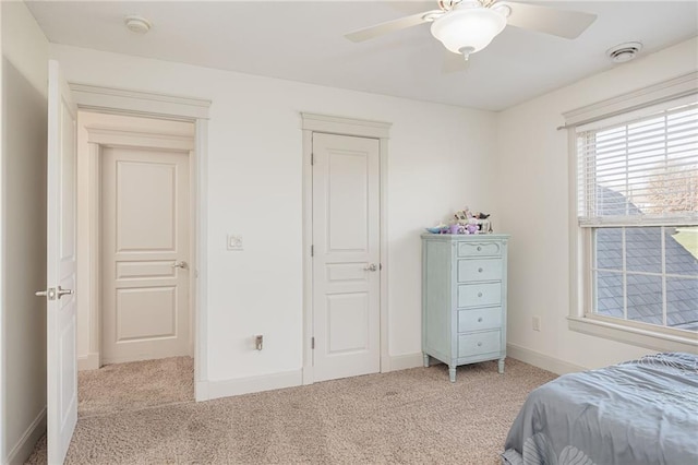 carpeted bedroom featuring ceiling fan