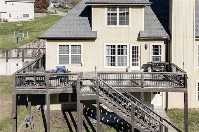 rear view of house featuring a deck