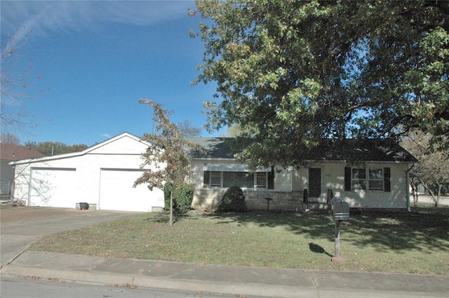 ranch-style house featuring a garage and a front lawn