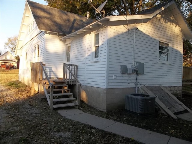 view of property exterior featuring central AC