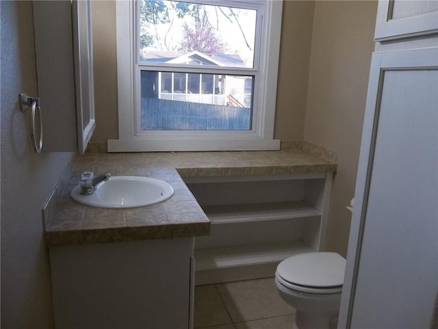 bathroom with tile patterned floors, vanity, and toilet