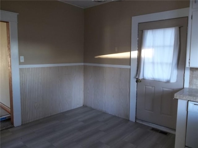 entryway with hardwood / wood-style floors