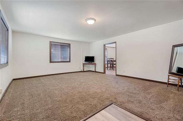 unfurnished living room with carpet floors