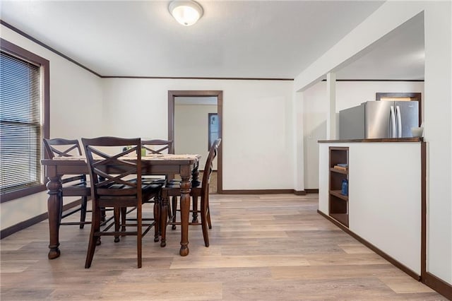 dining room with light wood-type flooring