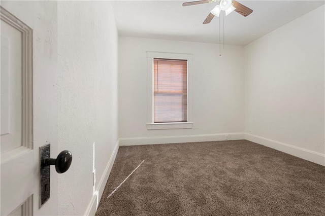 empty room with carpet flooring and ceiling fan