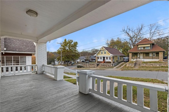 wooden terrace featuring a porch