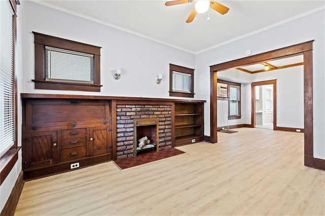 living room with ceiling fan, a fireplace, light wood-type flooring, and ornamental molding