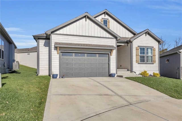 view of front of home featuring cooling unit, a front lawn, and a garage