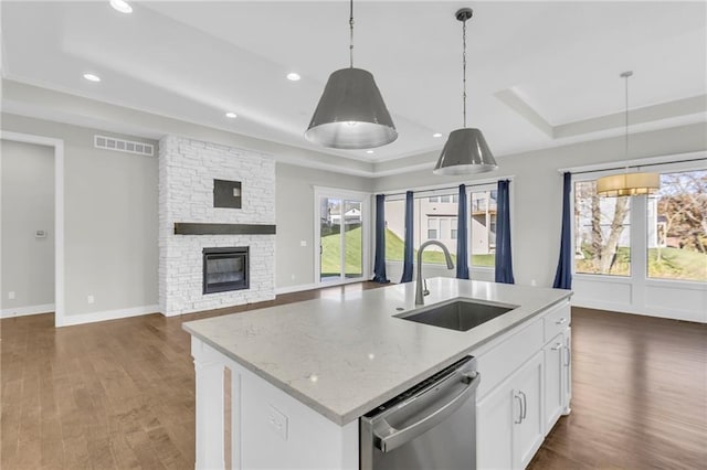 4520 NW 49th Ct, Riverside, MO 64150 - kitchen with a tray ceiling, stainless steel dishwasher, a sink, plenty of natural light, and recessed lighting