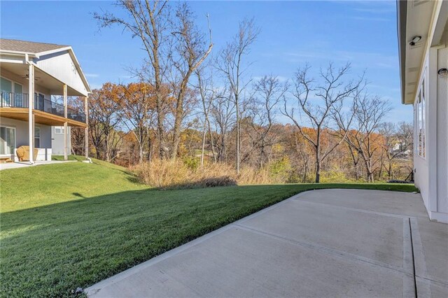 4520 NW 49th Ct, Riverside, MO 64150 - view of green lawn with a balcony and a patio