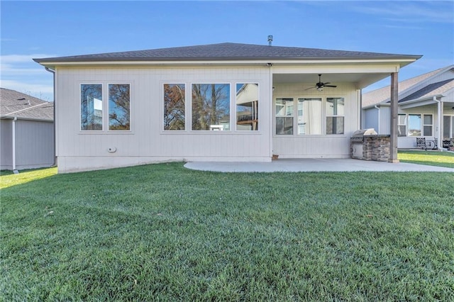 back of property featuring a yard, a patio, and ceiling fan