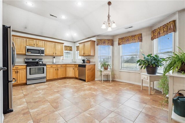 kitchen with visible vents, a chandelier, light countertops, lofted ceiling, and appliances with stainless steel finishes