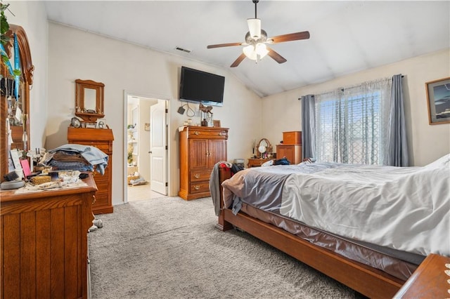 carpeted bedroom featuring vaulted ceiling, visible vents, and ceiling fan