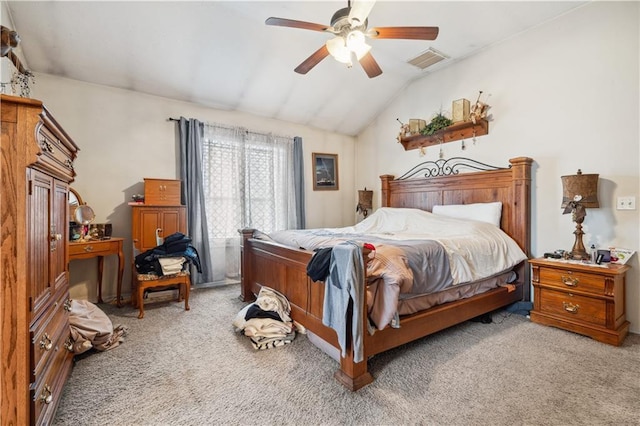 carpeted bedroom featuring visible vents, ceiling fan, and vaulted ceiling