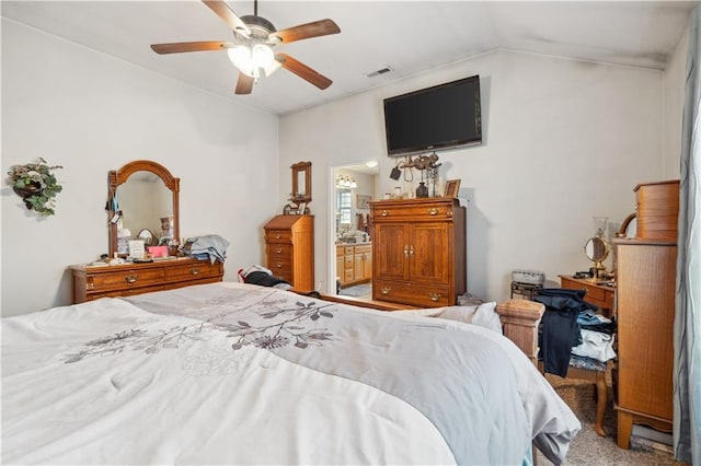 bedroom featuring lofted ceiling, visible vents, carpet floors, and ceiling fan