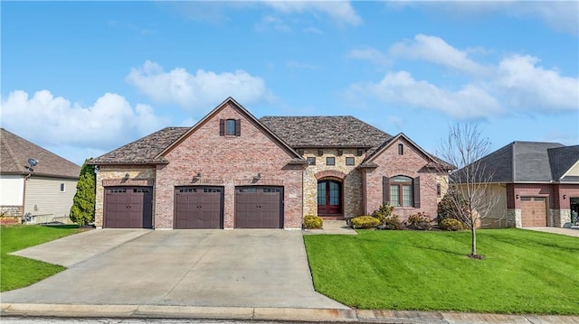 view of front facade featuring a garage and a front lawn