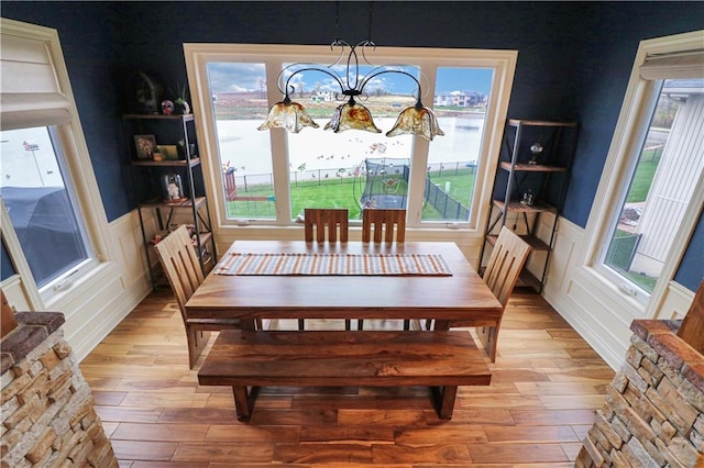 dining area with a chandelier and light wood-type flooring