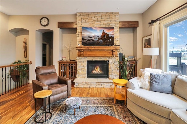 living room featuring a fireplace and hardwood / wood-style flooring