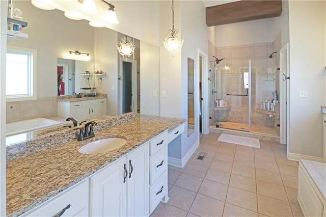 bathroom featuring tile patterned flooring, vanity, shower with separate bathtub, and a chandelier