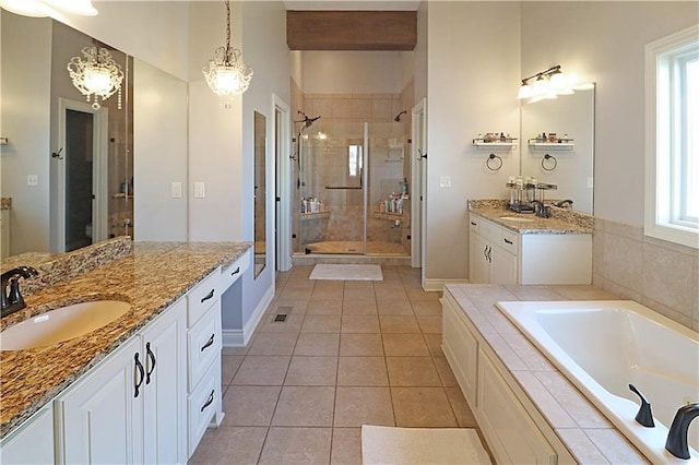 bathroom with separate shower and tub, tile patterned flooring, and vanity