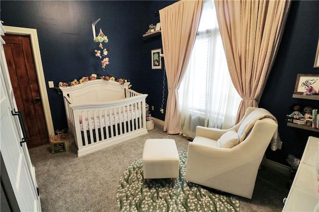 carpeted bedroom with a crib