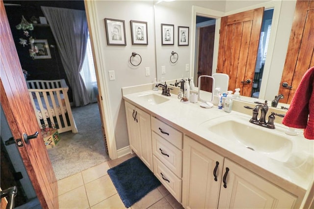 bathroom featuring tile patterned flooring and vanity