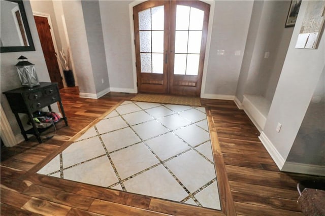 entrance foyer featuring french doors and dark wood-type flooring