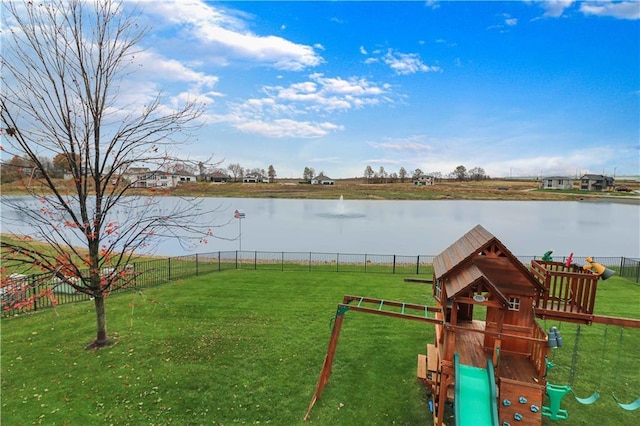 view of yard featuring a playground and a water view