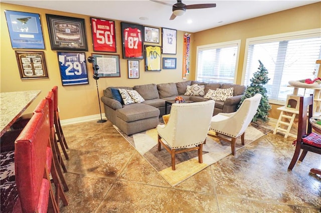 living room with tile patterned floors and ceiling fan