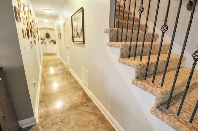 corridor featuring concrete flooring