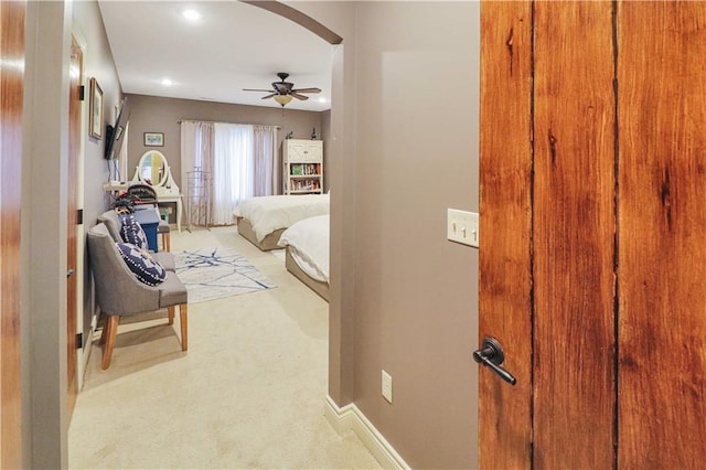 bedroom featuring ceiling fan and light colored carpet