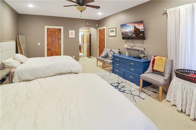 bedroom featuring ceiling fan and light colored carpet