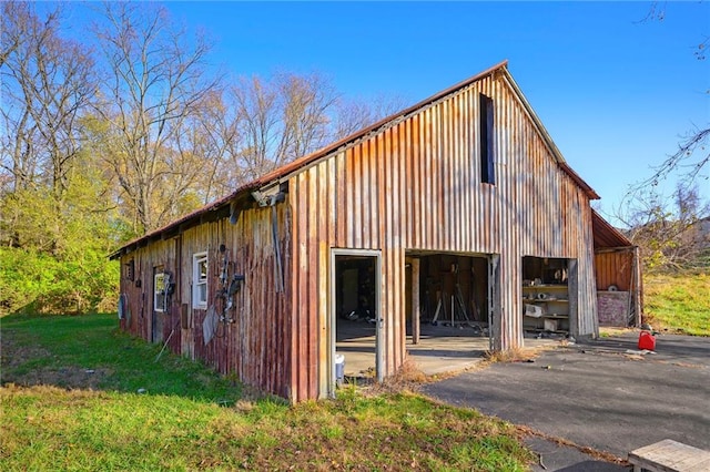 view of property exterior featuring an outbuilding