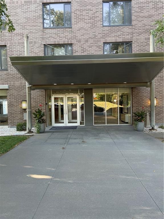 view of exterior entry featuring french doors