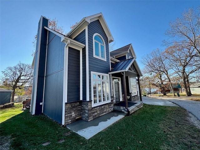 view of property exterior featuring a lawn