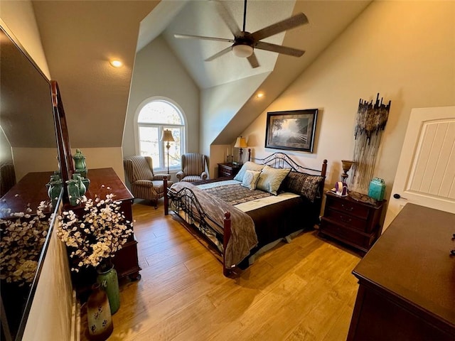 bedroom featuring ceiling fan, light hardwood / wood-style floors, and high vaulted ceiling