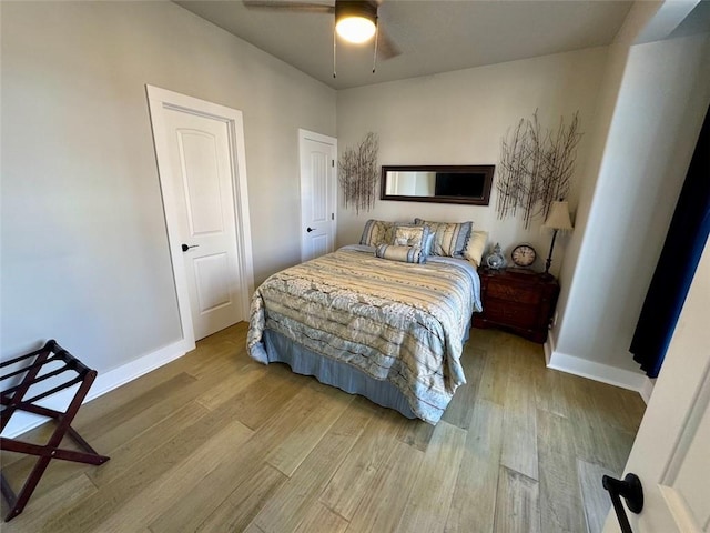 bedroom with ceiling fan and light wood-type flooring