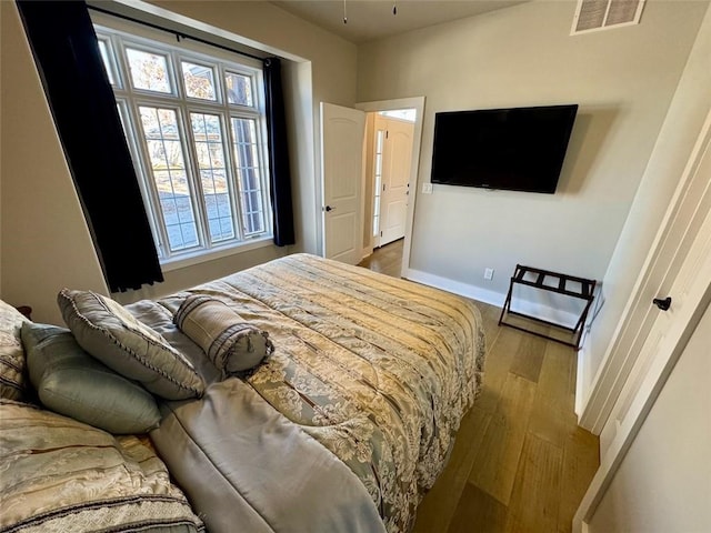 bedroom with light wood-type flooring