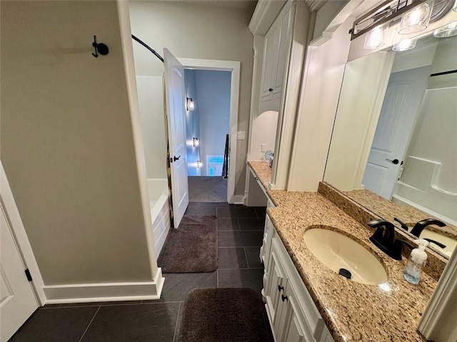 bathroom featuring vanity, tile patterned floors, and shower / bathing tub combination