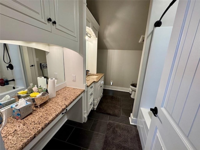 full bathroom featuring lofted ceiling, tub / shower combination, tile patterned flooring, vanity, and toilet