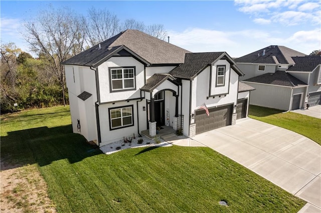 view of front of home with a front lawn and a garage